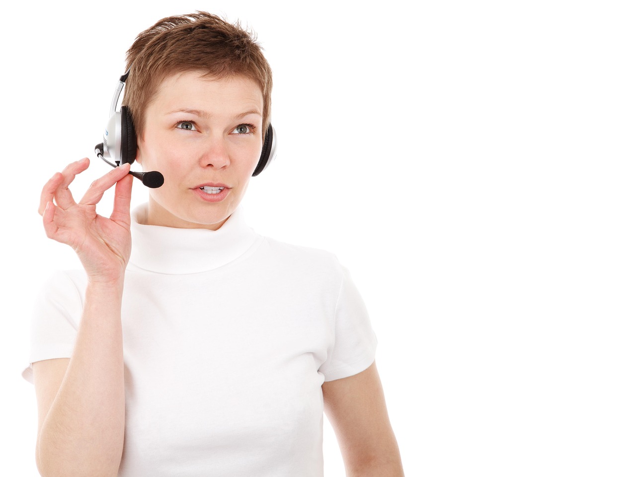 Professional woman wearing a headset and speaking on the phone in a modern office